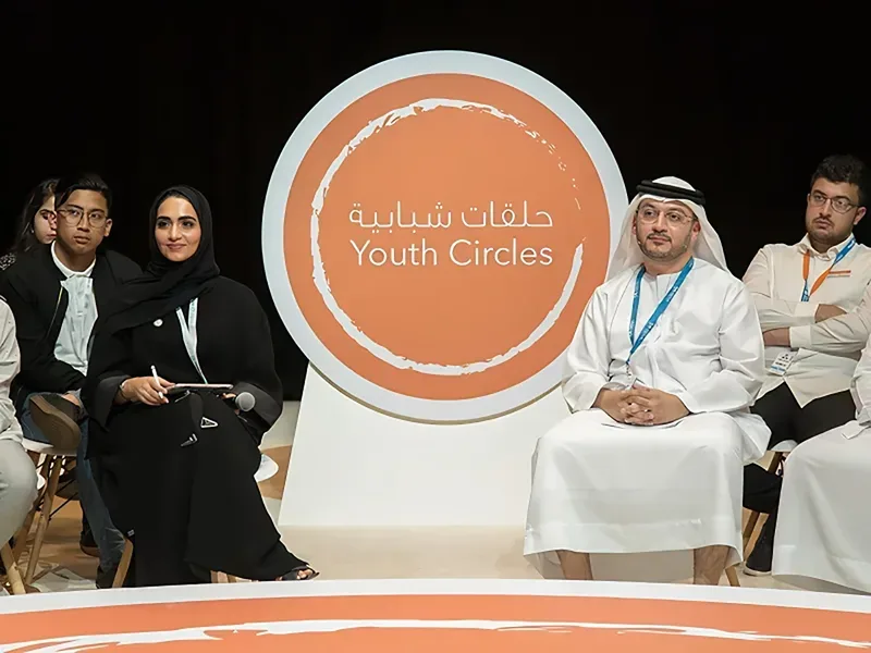 Abu Dhabi Sustainability Week Youth Circles discussion with participants seated around a branded circular forum setup