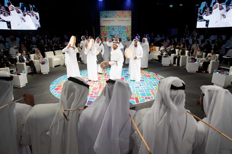 Evolution Events circular performance arena with tiered seating, dual screens and branded Culture Summit backdrop