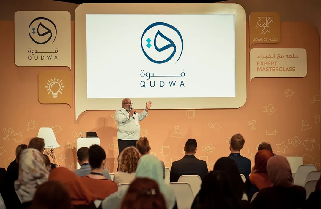 Expert Masterclass presenter engaging teachers within the orange Qudwa breakout space