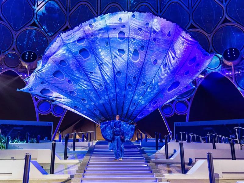Mass cast theatrical performance with elaborate props engineered by Evolution Scenic