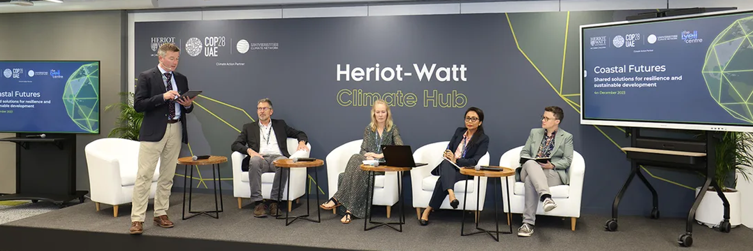 A two-week climate hub transformed through scenic design, furniture, signage and communication materials into a platform for international dialogue.