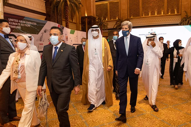 VIP delegation walking through the UAE Regional Climate Dialogue exhibition and timeline installation