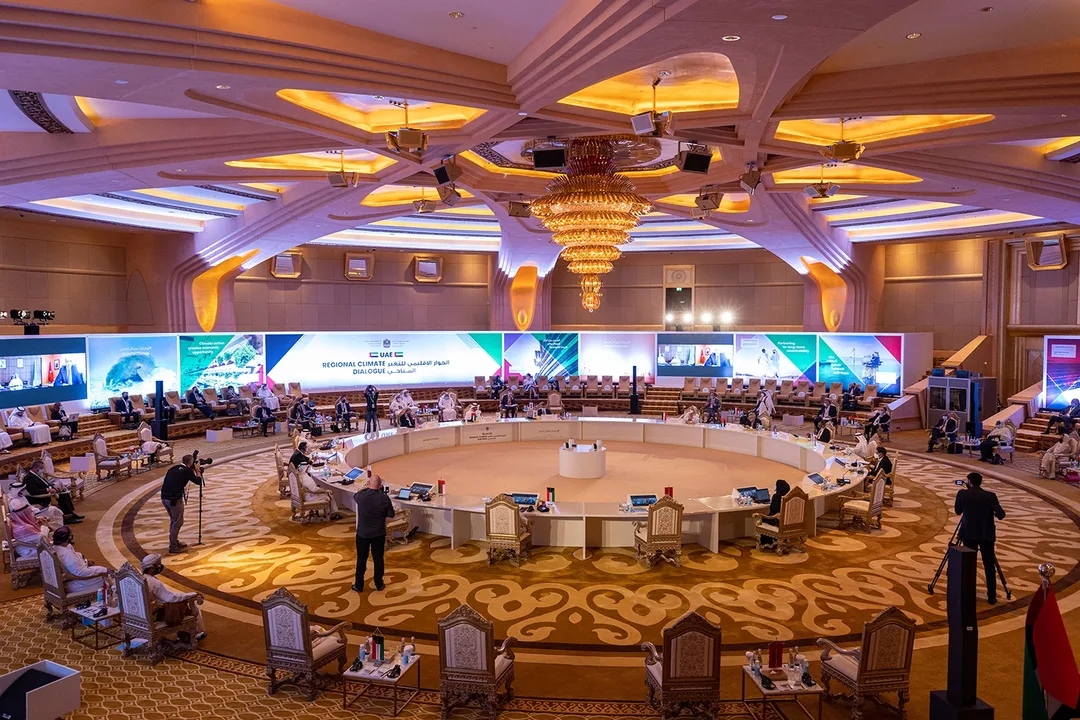 A hybrid ministerial setting in which physical and remote participants were given a visible place within one shared climate dialogue.