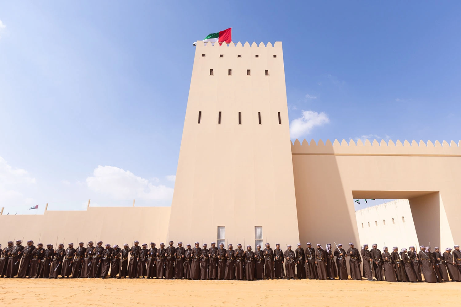 Traditional Emirati tribal participants assembled outside Al Wathba Fort during the Al Wathba Tribal Parade 2024