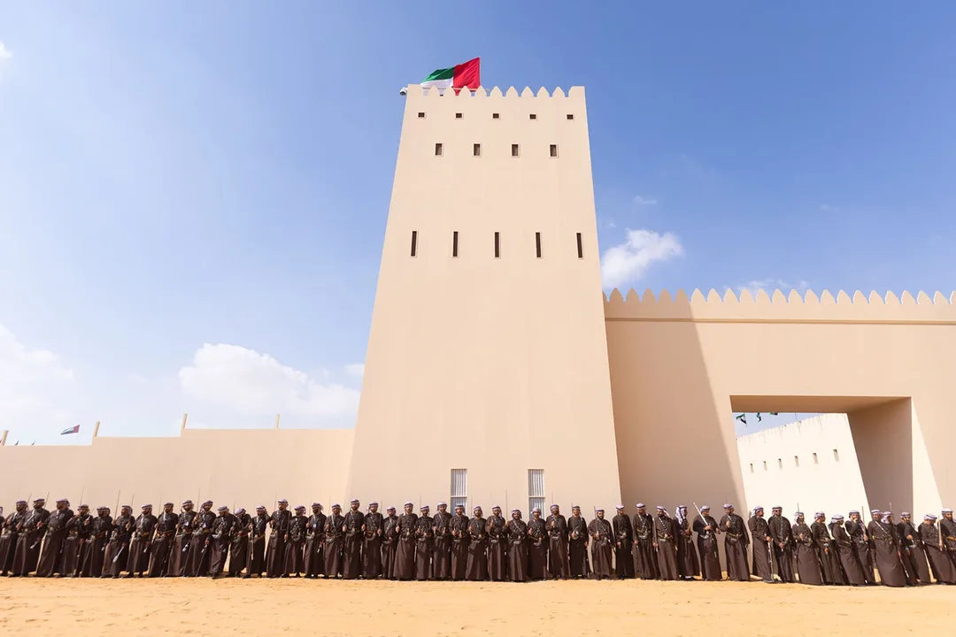 Traditional Emirati tribal participants assembled outside Al Wathba Fort during the Al Wathba Tribal Parade 2024