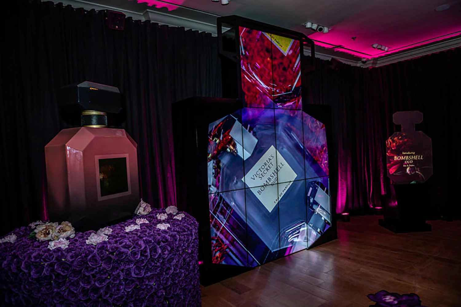 Evolution Scenic immersive Victoria’s Secret perfume launch installation with oversized bottles and digital video wall